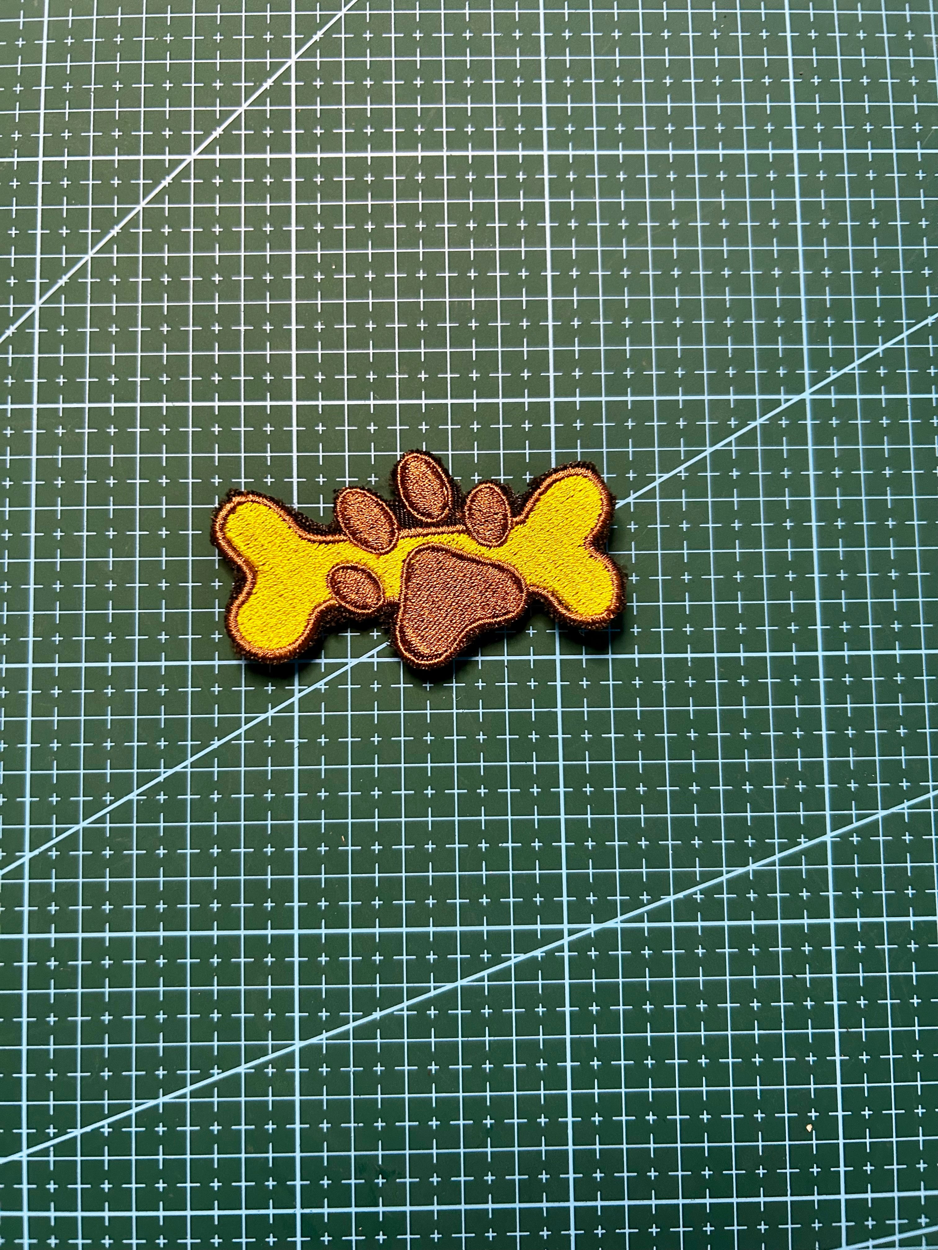 Knochen mit Pfotenabdruck-Patch